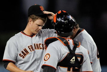 LOS ANGELES, CA - APRIL 15:  Pitcher Matt Cain #18 (L) of the San Francisco Giants gets visit from catcher Bengie Molina #1 and pitching coach Dave Righetti #44 after giving up a bases loaded walk to James Loney #7 of the Los Angeles Dodgers to score Orlando Hudson #13 from thrid base during the first inning of the baseball game at Dodger Stadium on April 15, 2009 in Los Angeles, California. All Major League Baseball players are wearing #42 in honor of Jackie Robinson day.  (Photo by Kevork Djansezian/Getty Images)