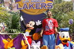 ANAHEIM, CA - JUNE 18:  In this handout provided by Disney, Lakers star and NBA Finals MVP Kobe Bryant waves to thousands of fans during a parade celebrating the 2009 World Champion Los Angeles Lakers at Disneyland on June 18, 2009 in Anaheim, California.  (Photo by Scott Brinegar/Disney via Getty Images)