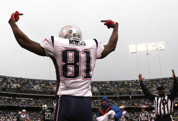 OAKLAND, CA - DECEMBER 14:  Randy Moss #81 of the New England Patriots celeberates after scoring a touchdwon against the Oakland Raiders during an NFL game on December 14, 2008 at the Oakland-Alameda County Coliseum in Oakland, California.  (Photo by Jed Jacobsohn/Getty Images)