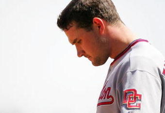 SAN FRANCISCO - MAY 13:  Ryan Zimmerman #11 of the Washington Nationals waits for his hat and glove in between innings of their game against the San Francisco Giants at AT&T Park on May 13, 2009 in San Francisco, California.  (Photo by Ezra Shaw/Getty Images)