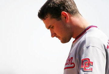 SAN FRANCISCO - MAY 13:  Ryan Zimmerman #11 of the Washington Nationals waits for his hat and glove in between innings of their game against the San Francisco Giants at AT&T Park on May 13, 2009 in San Francisco, California.  (Photo by Ezra Shaw/Getty Images)