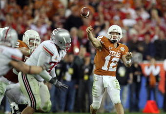 GLENDALE, AZ - JANUARY 05:  Quarterback Colt McCoy #12 of the Texas Longhorns throws a pass against the Ohio State Buckeyes during the Tostitos Fiesta Bowl Game on January 5, 2009 at University of Phoenix Stadium in Glendale, Arizona.   The Longhorns defeated the Buckeyes 24-21.  (Photo by Jed Jacobsohn/Getty Images)