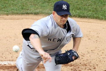 NEW YORK - JUNE 27:  A.J. Burnett #34 of the New York Yankees pitches against the New York Mets on June 27, 2009 at Citi Field in the Flushing neighborhood of the Queens borough of New York City.  (Photo by Jim McIsaac/Getty Images)