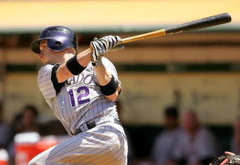 OAKLAND, CA - JUNE 28:  Clint Barmes #12 of the Colorado Rockies bats against the Oakland Athletics at the Oakland Coliseum on June 28, 2009 in Oakland, California.  (Photo by Ezra Shaw/Getty Images)
