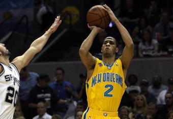 SAN ANTONIO - MAY 15:  Guard Jannero Pargo #2 of the New Orleans Hornets takes a shot against Manu Ginobili #20 of the San Antonio Spurs in Game Six of the Western Conference Semifinals during the 2008 NBA Playoffs at the AT&T Center on May 15, 2008 in San Antonio, Texas. NOTE TO USER: User expressly acknowledges and agrees that, by downloading and or using this photograph, User is consenting to the terms and conditions of the Getty Images License Agreement.  (Photo by Ronald Martinez/Getty Images)
