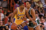 LOS ANGELES - 1987:  Magic Johnson #32 of the Los Angeles Lakers posts up Dennis Johnson #3 of the Boston Celtics during an NBA game at the Great Western Forum in Los Angeles, California in 1987. (Photo by: Rick Stewart/Getty Images)