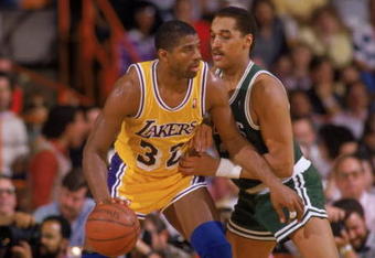 LOS ANGELES - 1987:  Magic Johnson #32 of the Los Angeles Lakers posts up Dennis Johnson #3 of the Boston Celtics during an NBA game at the Great Western Forum in Los Angeles, California in 1987. (Photo by: Rick Stewart/Getty Images)