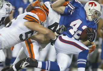 ORCHARD PARK, NY - AUGUST 26:  Jim Leonhard #42 of the Buffalo Bills returns a punt and is tackled by Kenny Kern #48 and Justin Kurpeikis #56 of the Cleveland Browns  on August 26, 2006 at Ralph Wilson Stadium in Orchard Park, New York. (Photo by Rick Stewart/Getty Images)