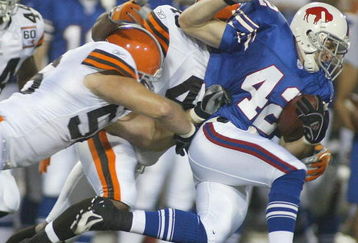 ORCHARD PARK, NY - AUGUST 26:  Jim Leonhard #42 of the Buffalo Bills returns a punt and is tackled by Kenny Kern #48 and Justin Kurpeikis #56 of the Cleveland Browns  on August 26, 2006 at Ralph Wilson Stadium in Orchard Park, New York. (Photo by Rick Stewart/Getty Images)