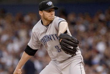 NEW YORK _ JUNE 3:  Roy Halladay #32 of the Toronto Blue Jays delivers a pitch during the game against the New York Yankees on June 3, 2008 at Yankee Stadium in the Bronx borough of New York City. (Photo by: Nick Laham/Getty Images)