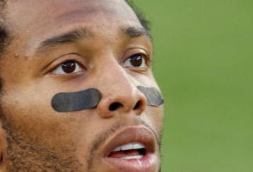 TAMPA, FL - FEBRUARY 01:  Wide receiver Larry Fitzgerald #11 of the Arizona Cardinals looks on as he warms up against the Pittsburgh Steelers during Super Bowl XLIII on February 1, 2009 at Raymond James Stadium in Tampa, Florida.  (Photo by Jamie Squire/Getty Images)