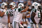 SAN DIEGO - SEPTEMBER 22:  Quarterback Brett Favre #4 of the New York Jets celebrates with teammate D'Brickashaw Ferguson #60 after throwing a three-yard touchdown pass against the San Diego Chargers in the second quarter on September 22, 2008 at Qualcomm Stadium in San Diego, California. The Chargers defeated the Jets 48-29.  (Photo by Stephen Dunn/Getty Images)