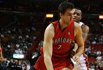 MIAMI - NOVEMBER 19:  Andrea Bargnani #7 of the Toronto Raptors drives past Daequan Cook #14 of the Miami Heat at American Airlines Arena on November 19, 2008 in Miami, Florida. The Raptors defeated the Heat 101-95. NOTE TO USER: User expressly acknowledges and agrees that, by downloading and/or using this Photograph, user is consenting to the terms and conditions of the Getty Images License Agreement.  (Photo by Doug Benc/Getty Images)