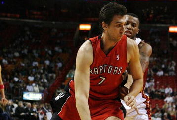 MIAMI - NOVEMBER 19:  Andrea Bargnani #7 of the Toronto Raptors drives past Daequan Cook #14 of the Miami Heat at American Airlines Arena on November 19, 2008 in Miami, Florida. The Raptors defeated the Heat 101-95. NOTE TO USER: User expressly acknowledges and agrees that, by downloading and/or using this Photograph, user is consenting to the terms and conditions of the Getty Images License Agreement.  (Photo by Doug Benc/Getty Images)