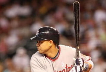 PHOENIX - MAY 10:  Alex Cintron #13 of the Washington Nationals at bat during the major league baseball game against the Arizona Diamondbacks at Chase Field on May 10, 2009 in Phoenix, Arizona.  The Diamondbacks defeated the Nationals 10-8.  (Photo by Christian Petersen/Getty Images)
