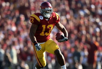 PASADENA, CA - JANUARY 01:  Stafon Johnson #13 of the USC Trojans rushes the ball during the 95th Rose Bowl Game presented by Citi against the Penn State Nittany Lions at the Rose Bowl on January 1, 2009 in Pasadena, California. The Trojans defeated the Nittany Lions 38-24.  (Photo by Christian Petersen/Getty Images)