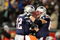 FOXBORO, MA - JANUARY 20:  (L-R) Tom Brady #12 and Dan Koppen #67 of the New England Patriots celebrate after Brady threw a 6-yard touchdown to Wes Welker #83 in the fourth quarter against the San Diego Chargers during the AFC Championship Game on January 20, 2008 at Gillette Stadium in Foxboro, Massachusetts.  (Photo by Al Bello/Getty Images)