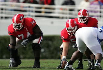 ATHENS, GA - NOVEMBER 19: Offensive lineman Max Jean-Gilles #74 and Russ Tanner #50 of the Georgia Bulldogs wait for the signal from quarterback D.J. Shockley #3 against the Kentucky Wildcats at Sanford Stadium on November 19, 2005 in Athens, Georgia.  (Photo by Doug Benc/Getty Images)