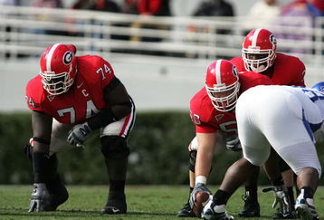 ATHENS, GA - NOVEMBER 19: Offensive lineman Max Jean-Gilles #74 and Russ Tanner #50 of the Georgia Bulldogs wait for the signal from quarterback D.J. Shockley #3 against the Kentucky Wildcats at Sanford Stadium on November 19, 2005 in Athens, Georgia.  (Photo by Doug Benc/Getty Images)