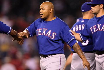 ANAHEIM, CA - JULY 8:  Andruw Jones #25 of the Texas Rangers celebrates with teammates after the game with the Los Angeles Angels of Anaheim at Angel Stadium July 8, 2009 in Anaheim, California.  Jones hit three home runs in the game as the Rangers won 8-1.   (Photo by Stephen Dunn/Getty Images)