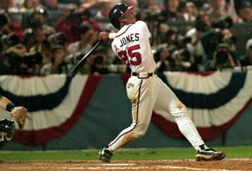 ATLANTA - OCTOBER 22:  Andruw Jones #25 of the Atlanta Braves bats during Game three of the 1996 World Series against the New York Yankees at Atlanta-Fulton County Stadium on October 22, 1996 in Atlanta, Georgia. The Yankees defeated the Braves 5-2. (Photo by Stephen Dunn/Getty Images)
