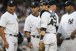 NEW YORK - JULY 2: (L-R) Alex Rodriguez #13, Derek Jeter #2, Francisco Cervelli #29, pitching coach Dave Eiland #58, CC Sabathia #55 and Robinson Cano #24 of the New York Yankees meet on the mound during action against the Seattle Mariners at Yankee Stadium on July 2, 2009 in the Bronx borough of New York City.  (Photo by Nick Laham/Getty Images)