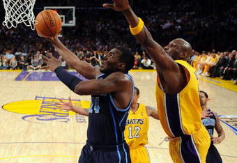 LOS ANGELES, CA - APRIL 21:  Paul Millsap #24 of the Utah Jazz shoots in front of Lamar Odom #7 of the Los Angeles Lakers in Game Two of the Western Conference Quarterfinals during the 2009 NBA Playoffs at Staples Center on April 21, 2009 in Los Angeles, California. NOTE TO USER: User expressly acknowledges and agrees that, by downloading and or using this photograph, User is consenting to the terms and conditions of the Getty Images License Agreement.  (Photo by Kevork Djansezian/Getty Images)