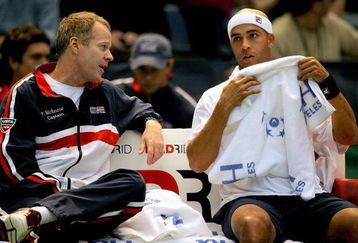 BIRMINGHAM, AL - MARCH 06:  Coach Patrick McEnroe confers with James Blake between games against Stanislas Wawrinka of Switzerland during the first rubber of their Davis Cup tie at Birmingham-Jefferson Convention Complex Arena March 6, 2009 in Birmingham, Alabama.  (Photo by Matthew Stockman/Getty Images)