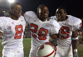 11 Nov 2001:  Victor Stephens#8, Lamont Reid#28 and Roger Pollard #39 of NC St. celebrate after the Florida State/North Carolina State game at Doak Campell Stadium in Tallahassee , FL..  NC St. won 34-28.  DIGITAL IMAGE   Mandatory Credit: Andy Lyons/ALLSPORT