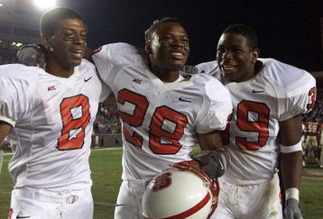 11 Nov 2001:  Victor Stephens#8, Lamont Reid#28 and Roger Pollard #39 of NC St. celebrate after the Florida State/North Carolina State game at Doak Campell Stadium in Tallahassee , FL..  NC St. won 34-28.  DIGITAL IMAGE   Mandatory Credit: Andy Lyons/ALLSPORT