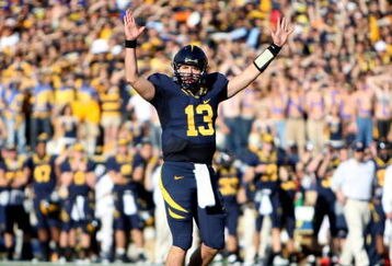 BERKELEY, CA - NOVEMBER 22:  Kevin Riley #13 of the California Golden Bears signals for a touchdown against the Stanford Cardinal during an NCAA football game on November 22, 2008 at Memorial Stadium in Berkeley, California.  (Photo by Jed Jacobsohn/Getty Images)