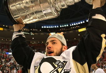 DETROIT - JUNE 12: Kris Letang #58 of the Pittsburgh Penguins celebrates following the Penguins victory over the Detroit Red Wings in Game Seven of the 2009 NHL Stanley Cup Finals at Joe Louis Arena on June 12, 2009 in Detroit, Michigan. (Photo by Bruce Bennett/Getty Images)