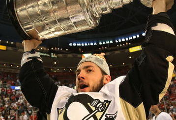 DETROIT - JUNE 12: Kris Letang #58 of the Pittsburgh Penguins celebrates following the Penguins victory over the Detroit Red Wings in Game Seven of the 2009 NHL Stanley Cup Finals at Joe Louis Arena on June 12, 2009 in Detroit, Michigan. (Photo by Bruce Bennett/Getty Images)