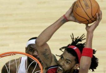 CLEVELAND - MAY 08:  Mikki Moore #33 of the New Jersey Nets dunks in front of LeBron James #23 the Cleveland Cavaliers in Game Two of the Eastern Conference Semifinals during the 2007 NBA Playoffs at Quicken Loans Arena on May 8, 2007 in Cleveland, Ohio. Cleveland won Game Two 102-92. NOTE TO USER: User expressly acknowledges and agrees that, by downloading and or using this photograph, User is consenting to the terms and conditions of the Getty Images License Agreement.  (Photo by Gregory Shamus/Getty Images)