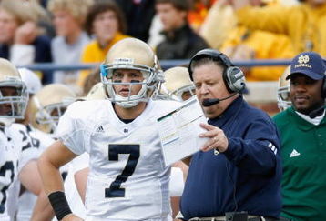 ANN ARBOR, MI - SEPTEMBER 15:  Jimmy Clausen #7 stands next to head coach Charlie Weis of the Notre Dame Fighting Irish during the game against the Michigan Wolverines on September 15, 2007 at Michigan Stadium in Ann Arbor, Michigan. Michigan won 38-0. (Photo by Gregory Shamus/Getty Images)  