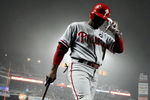 NEW YORK - JUNE 11: Jimmy Rollins #11 of the Philadelphia Phillies on deck to bat against the New York Mets on June 11, 2009 at Citi Field in the Flushing neighborhood of the Queens borough of New York City. (Photo by Nick Laham/Getty Images)