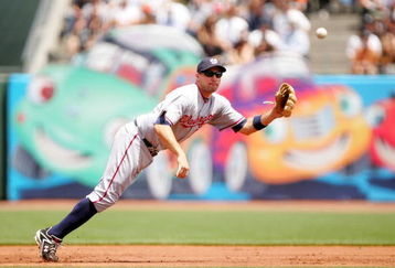 SAN FRANCISCO - MAY 13:  Ryan Zimmerman #11 of the Washington Nationals dives for a ball hit by Edgar Renteria #16 of the San Francisco Giants in the first inning of their game at AT&T Park on May 13, 2009 in San Francisco, California. Zimmerman dropped the ball on the play.  (Photo by Ezra Shaw/Getty Images)