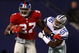EAST RUTHERFORD, NJ - NOVEMBER 11:  Brandon Jacobs #27 of the New York Giants breaks the tackle of Bradie James #56 of the Dallas Cowboys during their game at Giants Stadium November 11, 2007 in East Rutherford, New Jersey. The Giants won 31-20.  (Photo by Al Bello/Getty Images)