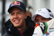 NURBURG, GERMANY - JULY 09:  Sebastian Vettel (L) of Germany and Red Bull Racing shares a joke with other German drivers in the paddock during previews to the German Formula One Grand Prix at Nurburgring on July 9, 2009 in Nurburg, Germany.  (Photo by Mark Thompson/Getty Images)