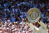 WIMBLEDON, ENGLAND - JULY 04:  Serena Williams of USA celebrates with the Championship trophy after the women's singles final match against Venus Williams of USA on Day Twelve of the Wimbledon Lawn Tennis Championships at the All England Lawn Tennis and Croquet Club on July 4, 2009 in London, England. Serena Williams of USA won 7-6, 6-2.  (Photo by Hamish Blair/Getty Images)