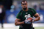 INDIANAPOLIS, IN - FEBRUARY 23:  Defensive lineman Mike Johnson of Georgia Tech runs during the NFL Scouting Combine presented by Under Armour at Lucas Oil Stadium on February 23, 2009 in Indianapolis, Indiana. (Photo by Scott Boehm/Getty Images)