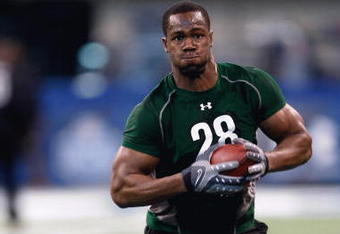 INDIANAPOLIS, IN - FEBRUARY 23:  Defensive lineman Mike Johnson of Georgia Tech runs during the NFL Scouting Combine presented by Under Armour at Lucas Oil Stadium on February 23, 2009 in Indianapolis, Indiana. (Photo by Scott Boehm/Getty Images)