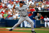 ATLANTA - JUNE 27:  Starting pitcher Tim Wakefield #49 of the Boston Red Sox pitches against the Atlanta Braves at Turner Field on June 27, 2009 in Atlanta, Georgia.  (Photo by Kevin C. Cox/Getty Images)