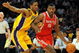LOS ANGELES, CA - MAY 06:  Ron Artest #96 of the Houston Rockets moves the ball against Trevor Ariza #3 of the Los Angeles Lakers in Game Two of the Western Conference Semifinals during the 2009 NBA Playoffs at Staples Center on May 6, 2009 in Los Angeles, California. NOTE TO USER: User expressly acknowledges and agrees that, by downloading and or using this photograph, User is consenting to the terms and conditions of the Getty Images License Agreement.  (Photo by Harry How/Getty Images)