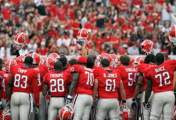ATHENS, GA - OCTOBER 11: The Georgia Bulldogs huddle on the field before the game against the Tennessee Volunteers at Sanford Stadium on October 11, 2008 in Athens, Georgia.  (Photo by Kevin C. Cox/Getty Images)