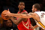 LOS ANGELES, CA - MAY 17:  Aaron Brooks #0 of the Houston Rockets looks to pass as he is covered by Jordan Farmar #5 of the Los Angeles Lakers in Game Seven of the Western Conference Semifinals during the 2009 NBA Playoffs at Staples Center on May 17, 2009 in Los Angeles, California. NOTE TO USER: User expressly acknowledges and agrees that, by downloading and or using this photograph, User is consenting to the terms and conditions of the Getty Images License Agreement.  (Photo by Stephen Dunn/Getty Images)