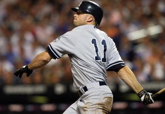 NEW YORK - JUNE 26:  Brett Gardner #11 of the New York Yankees follows through on a second-inning base hit against the New York Mets on June 26, 2009 at Citi Field in the Flushing neighborhood of the Queens borough of New York City.  (Photo by Jim McIsaac/Getty Images)