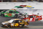 DAYTONA BEACH, FL - JULY 04:  Kasey Kahne, driver of the #9 Budweiser Dodge, crashes into the rear of Kyle Busch, driver of the #18 Interstate Batteries Toyota, after Kyle hit the wall on the final lap during the NASCAR Sprint Cup Series 51st Annual Coke Zero 400 at Daytona International Speedway on July 4, 2009 in Daytona Beach, Florida.  (Photo by Geoff Burke/Getty Images for NASCAR)