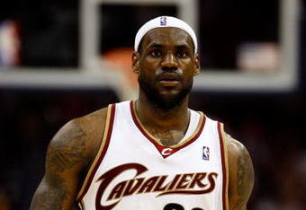 CLEVELAND - MAY 28:  LeBron James #23 of the Cleveland Cavaliers looks on between plays against the Orlando Magic in Game Five of the Eastern Conference Finals during the 2009 Playoffs at Quicken Loans Arena on May 28, 2009 in Cleveland, Ohio. NOTE TO USER: User expressly acknowledges and agrees that, by downloading and or using this photograph, User is consenting to the terms and conditions of the Getty Images License Agreement  (Photo by Gregory Shamus/Getty Images)