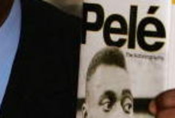 LONDON - MAY 18:  Brazilian football hero Pele holds copies of his autobiography at a book launch at the Virgin Megastore Picadilly on May 18, 2006 in London, England. The man they also call Edson Arantes do Nascimento attended the launch signing copies of his new book, Pele ? The Autobiography.  (Photo by Daniel Berehulak/Getty Images)